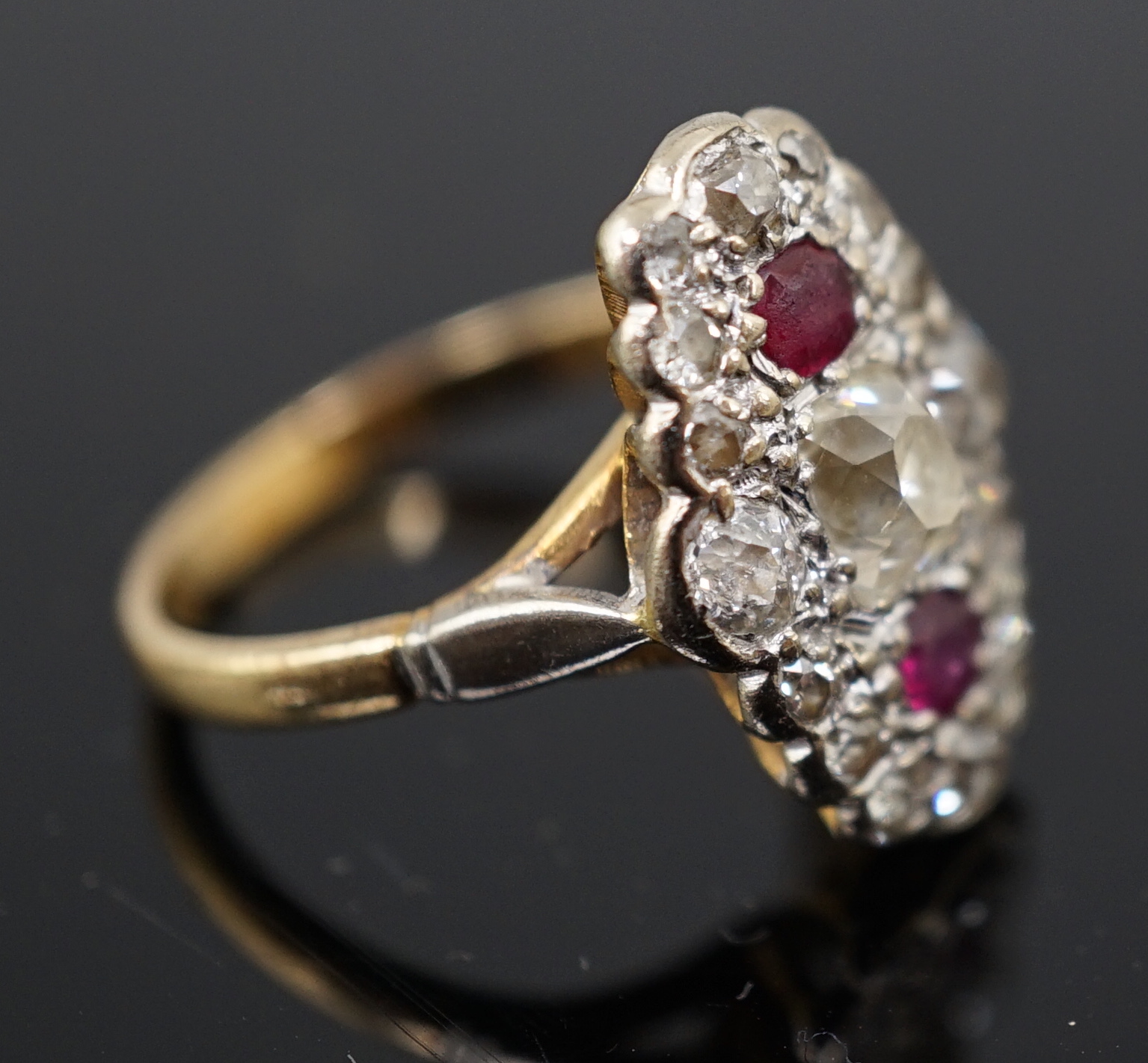 An 18ct gold ruby and diamond cluster ring